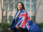 Jacinta Nampijinpa Price poses with an Australian Flag at Parliament House in Canberra. 