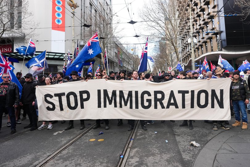 Anti-immigration protesters holding a banner reading 'Stop Immigration' on August 31, 2025 in Melbourne, Australia.