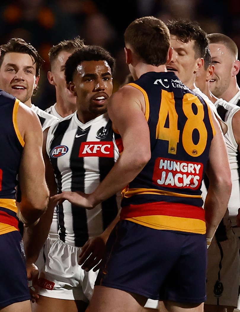 Isaac Quaynor and Mark Keane exchange words at halftime.