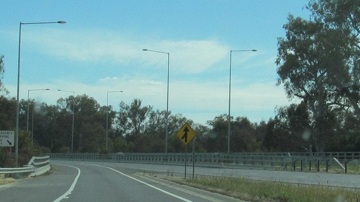 Two killed after stopping on highway.