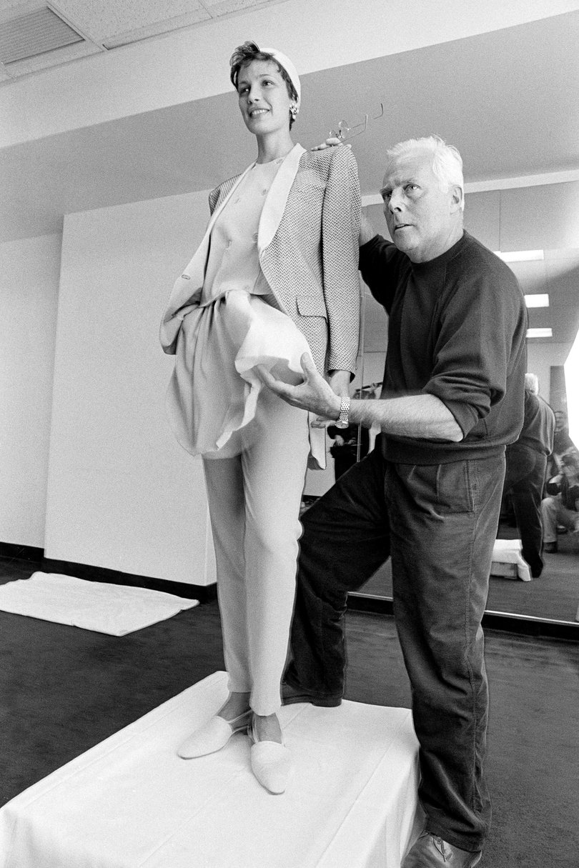 Giorgio Armani, sets up a fashion show in 1993.