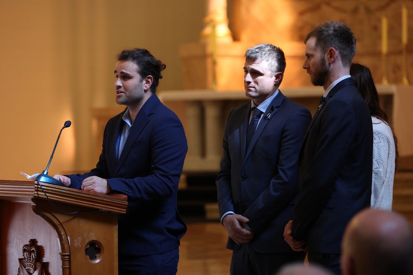 Sacha de Waart-Hottart speaks during the funeral service of his older brother.