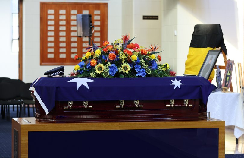 The police hat of Victoria Police officer Senior Constable Vadim De Waart sits on top of casket prior to his funeral service.
