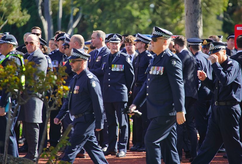 Police members and mourners arrive for the funeral service for Victoria Police officer, Senior Constable Vadim De Waart-Hottart.