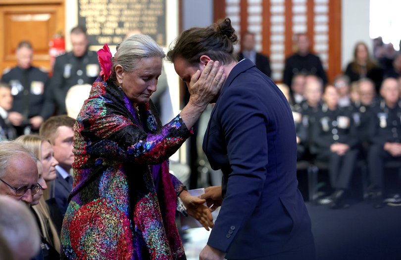 Carolina de Waart reacts with her son Sacha de Waart-Hottart after he addressed the funeral service of his older brother.