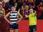 Mark O'Connor of the Cats is seen as Brent Wallace, AFL Field Umpire awards a free kick to Cam Rayner.
