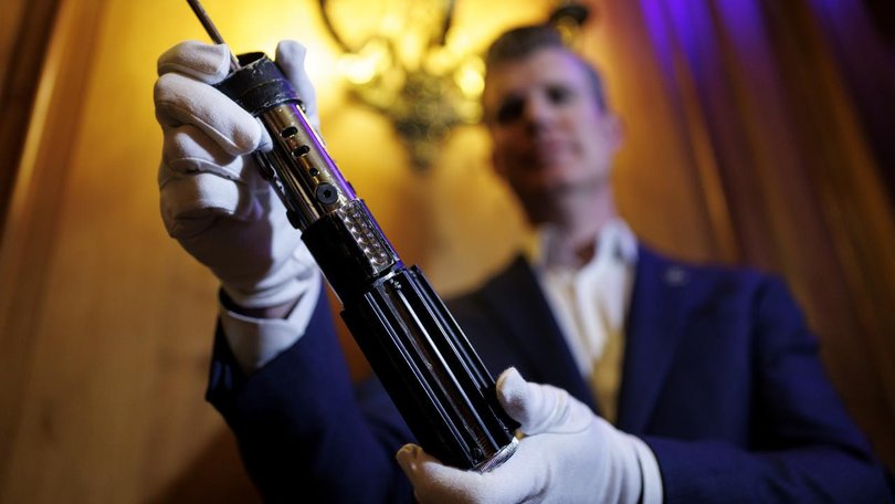 Darth Vader's lightsaber was among 400 lots of props and costumes that have gone under the hammer. (EPA PHOTO)
