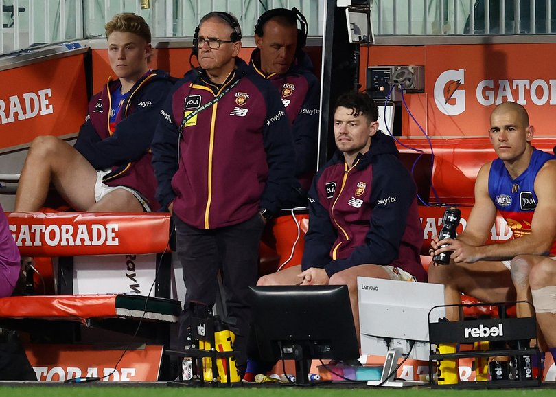 MELBOURNE, AUSTRALIA - SEPTEMBER 05: Chris Fagan, Senior Coach of the Lions and Lachie Neale of the Lions looks on from the bench during the AFL Second Qualifying Final match between the Geelong Cats and the Brisbane Lions at the Melbourne Cricket Ground on September 05, 2025 in Melbourne, Australia. (Photo by Michael Willson/AFL Photos via Getty Images)