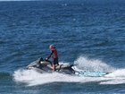 People on jet skis are still looking for the shark. Photo: NewsWire