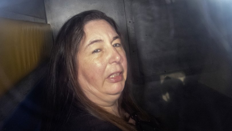 Erin Patterson arriving in the back of a prison transport vehicle in Morwell during her trial. 