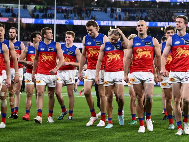 Brisbane Lions leave the field after the loss to Geelong. 