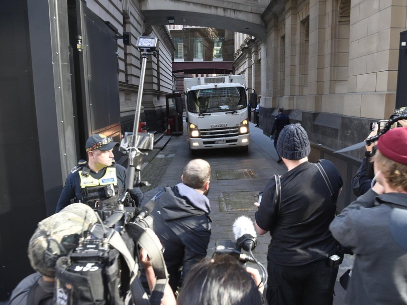 Media crews crowd around the prison van holding mushroom murderer Erin Patterson.