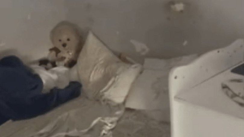 A six-year-old girl has been removed from her parent’s care after police found her trapped in a dark room where they believe she has spent her entire life.