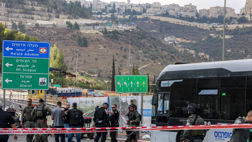 Israeli security forces gather next to a bus in Jerusalem after a suspected terror attack.