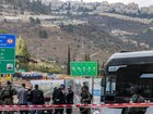 Israeli security forces gather next to a bus in Jerusalem after a suspected terror attack.