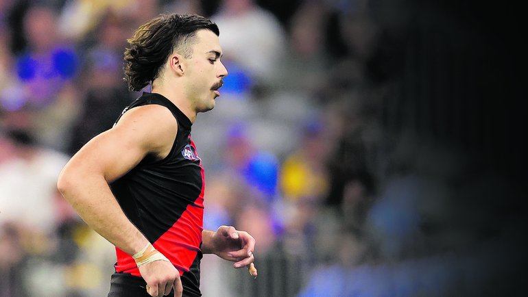 Essendon ruck Sam Draper exits the field in round six after suffering a season-ending injury. 