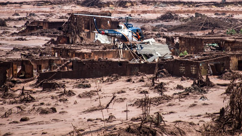 Enough mine waste to fill 13,000 Olympic-size swimming pools poured into the Doce River, wiping away villages and causing tens of billions of dollars worth of destruction.

