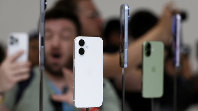 Attendees take pictures of the next generation iPhone 17 during an Apple special event.