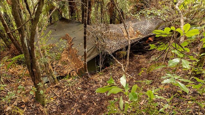 New photos have emerged of the 'grim' and 'dimly lit' main campsite used by fugitive Tom Phillips and his three children. Phillips was shot dead by police after he fired at an officer during a shootout after breaking into a store in Piopio on New Zealand's North Island in the early hours of Monday morning. He spent almost four years on the run with his three children in remote bushland. Unknown