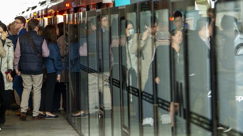 A metro train full of people is stuck inside a tunnel.