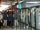A metro train full of people is stuck inside a tunnel.