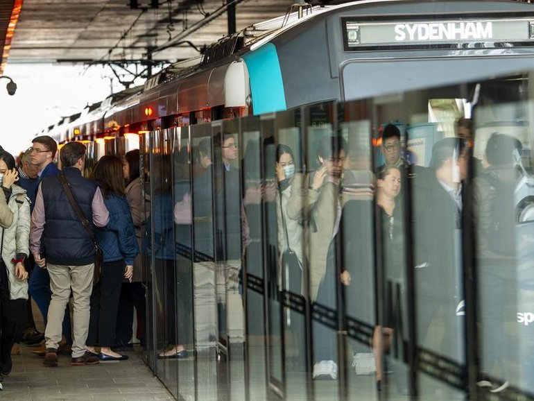 A metro train full of people is stuck inside a tunnel.