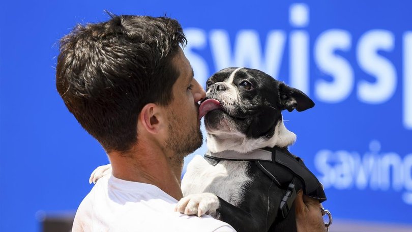 Pedro Cachin celebrated with his dog after winning his first ATP event at the Swiss Open.