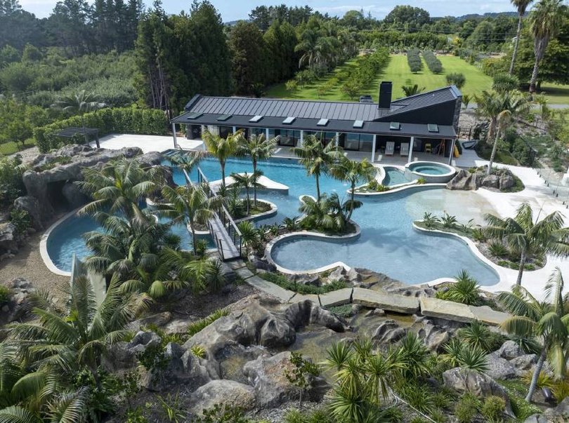 Tropical plants, waterfalls and rock formations create a poolside playground.