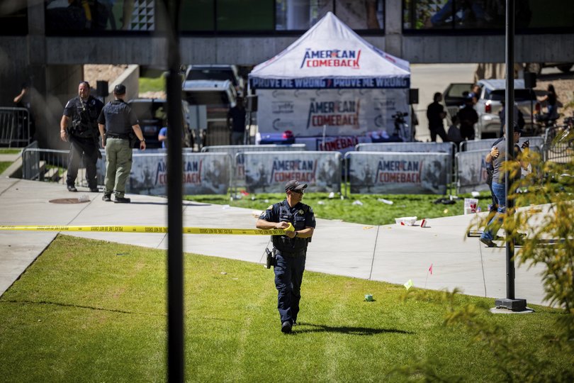 Law enforcement tapes off an area after Charlie Kirk was shot.