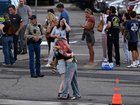 Students reunite with loved ones and classmates outside Bergen Meadow Elementary School after a shooting at Evergreen High School.