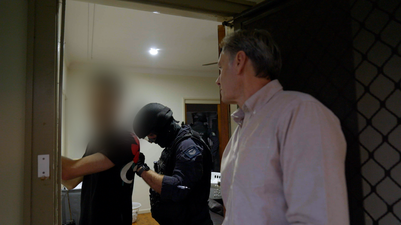 NSW Police’s Operational Support Group officers busting down a door of an alleged sex offender.