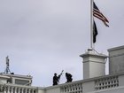 Secret Service countersnipers on the roof of the White House where the US flag was lowered to half-staff after Charlie Kirk was killed in Utah.