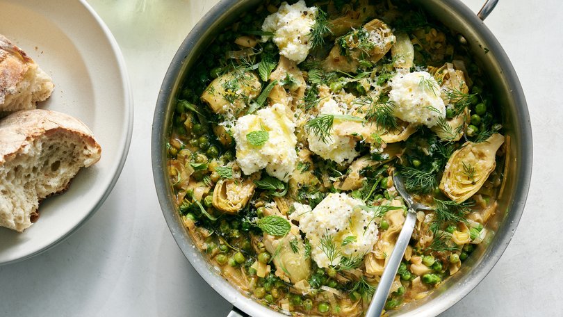 One-pan creamy artichokes and peas. Using canned artichokes and frozen peas keeps this fresh meal simple to make all year long. Food styled by Simon Andrews. 