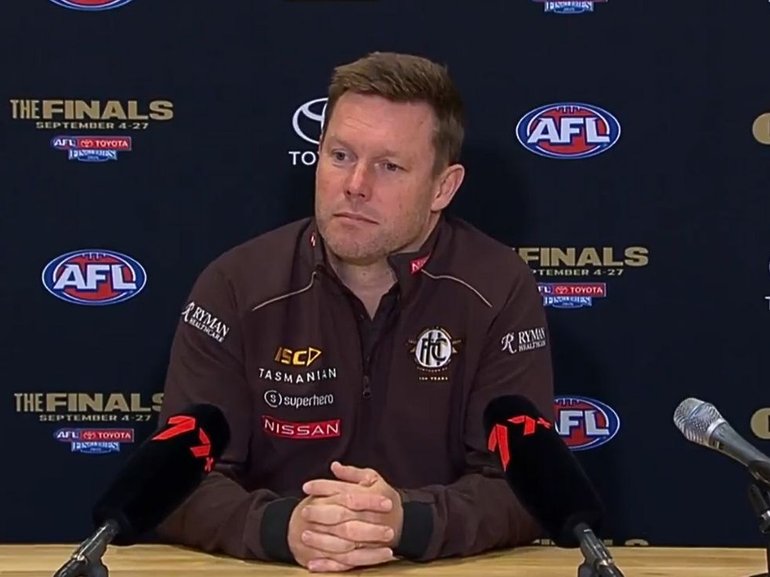 Hawthorn coach Sam Mitchell has no regrets about trying to recruit Essendon’s contracted captain Zach Merrett.