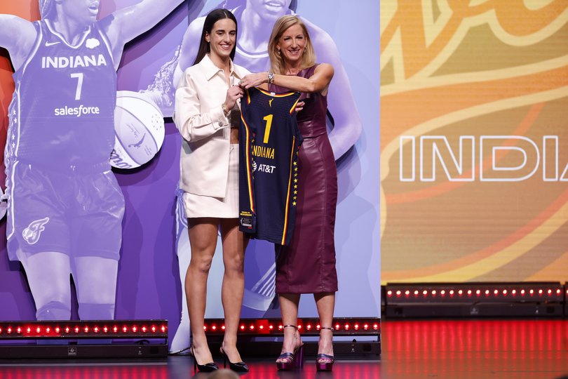 Caitlin Clark poses with WNBA Commissioner Cathy Engelbert.