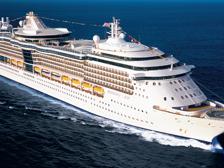 A cruise passenger has been charged after jumping off Royal Caribbean’s Rhapsody of the Seas ship with thousands in cash on him.