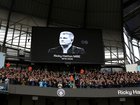 Players, fans, officials observe a minutes applause in memory of Ricky Hatton, prior to the Premier League match between Manchester City and Manchester United at Etihad Stadium.