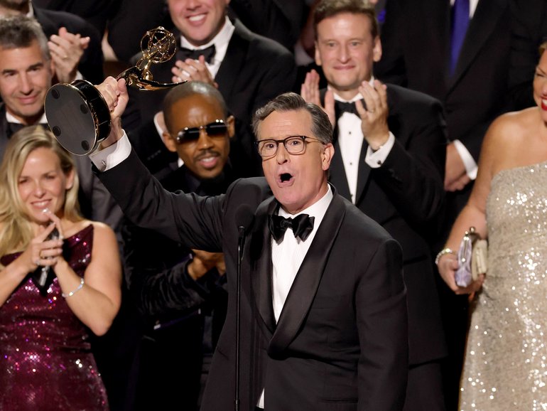 Stephen Colbert accepts the Outstanding Talk Series Award for The Late Show with Stephen Colbert onstage during the 77th Primetime Emmy Awards.