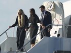 Vice President JD Vance, right, Second Lady Usha Vance, centre, and Erika Kirk deplane Air Force Two, carrying the body of Charlie Kirk.
