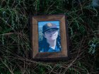 A framed photo of Ethan Dallas, 15, taken shortly before his suicide, on July 22, 2025.
