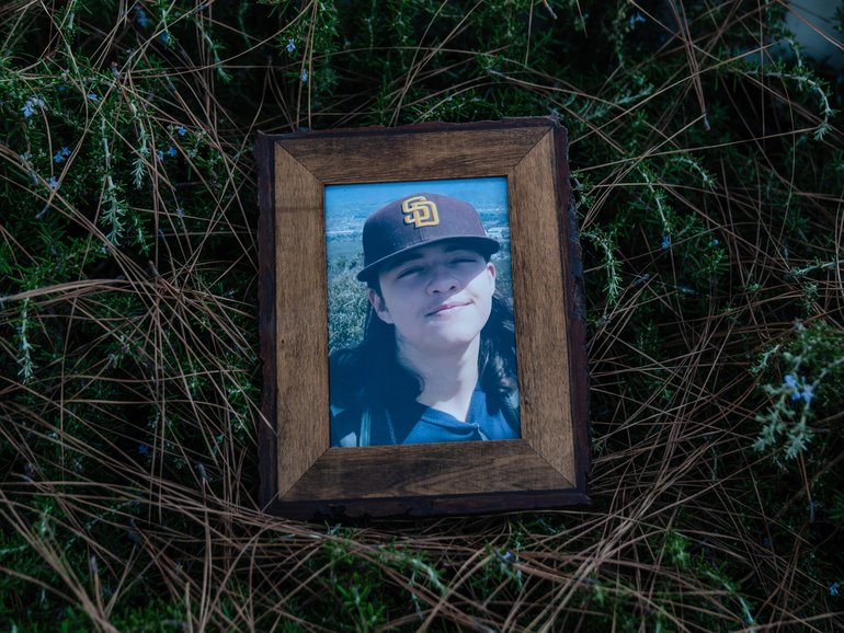 A framed photo of Ethan Dallas, 15, taken shortly before his suicide, on July 22, 2025.