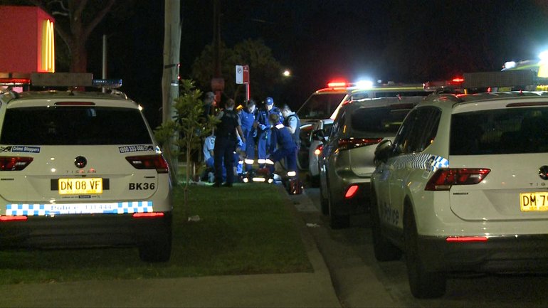 Police and paramedics at the scene of the Sydney stabbing attack.