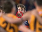 Riley Thilthorpe poked his tongue out during the national anthem.
