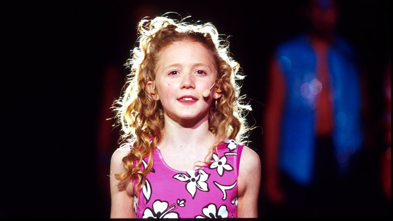 Nikki Webster pictured singing at the opening of the Sydney Olympics.   