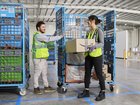 Workers loading up packages for Amazon at an Amazon delivery station in Perth.