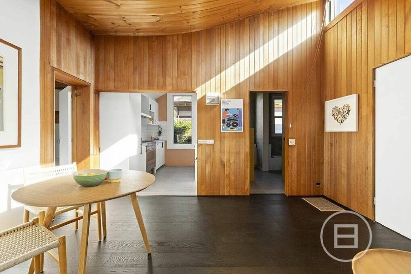 Open plan dining and living area in the second dwelling.