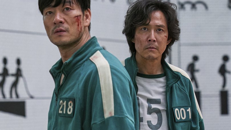 Lee Jung-jae, right, and Park Hae-soo in a scene from the Korean series "Squid Game."  (Netflix via AP)