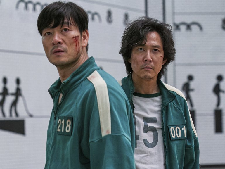 Lee Jung-jae, right, and Park Hae-soo in a scene from the Korean series "Squid Game."  (Netflix via AP)