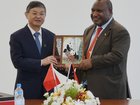 Chinese President Xi Jinping's special envoy and Minister of Ecology and Environment H.E. Huang Runqiu presents a gift to PNG Prime Minister James Marape on Monday.