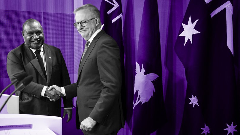 Australian Prime Minister Anthony Albanese shakes hands with Papua New Guinea's Prime Minister James Marape.